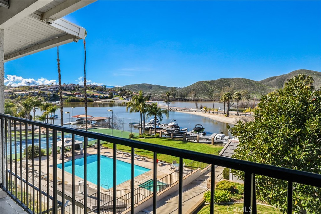 “Beautiful renovation on this 2 bedroom condo in a “private resort” location in Canyon Lake. Boat dock is footsteps away, there are private tennis courts, pool and jacuzzi, on site. Huge Price Improvement!! Every inch of this home has been thoughtfully upgraded with high-end finishes and smart design. Inside, you're greeted by elegant luxury vinyl plank flooring, designer ceiling fans, and a striking wood-burning fireplace with a custom-crafted mantel—creating a warm, sophisticated ambiance. Entertain with ease at the stylish wet bar, complete with a brand-new sink and faucet, or in the gourmet kitchen where quartz countertops, black stainless steel appliances (including an Alexa-enabled fridge), and an oven with built-in air fryer await your culinary creativity. A spacious walk-in pantry with an upgraded door adds both flair and function. Down the hallway, find custom built-in cabinets topped with matching quartz, a laundry room hidden behind chic barn doors, and a host of modern upgrades including a new water heater and generous storage space. Both bathrooms echo the home’s upscale aesthetic, featuring quartz countertops, sleek new mirrors and fixtures, reglazed tub, dual sinks in the primary suite, and a frameless glass shower for that spa-like feel. The bedrooms offer a tranquil escape, highlighted by vaulted ceilings, crown molding, and modern ceiling fans. As a smart home, it’s equipped with a Nest thermostat and keyless entry, providing seamless convenience and peace of mind. Beyond your private haven, enjoy an array of amenities offered by this sought-after condo community: a clubhouse with free Wi-Fi, pool and ping pong tables, and a big-screen TV; three guest suites with private baths available for rent; a tennis court; expansive green spaces; and full access to Canyon Lake’s clubhouse, parks, beaches, golf course, RV campground, and more. This is more than a home—it’s a lifestyle. Don’t miss your opportunity to LEASE this stunning lakefront gem!!
