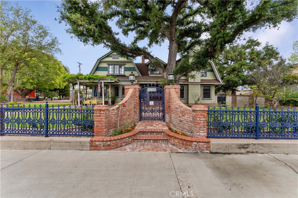 This home is a must see, from the outside to the entry way, you will be amazed..there is a living room area on one side and a full family room area with a bar on the other side. The dining room is enormous and ready to hold that grand dinner. The kitchen overlooks the eating area and the island holds up to 4 barstools. There are two bedrooms downstairs and four bedrooms up. The outside area has plenty of space for parking and enclosed garage space as well. The other side of the back yard is well landscaped with direct access to the gated pool area.
