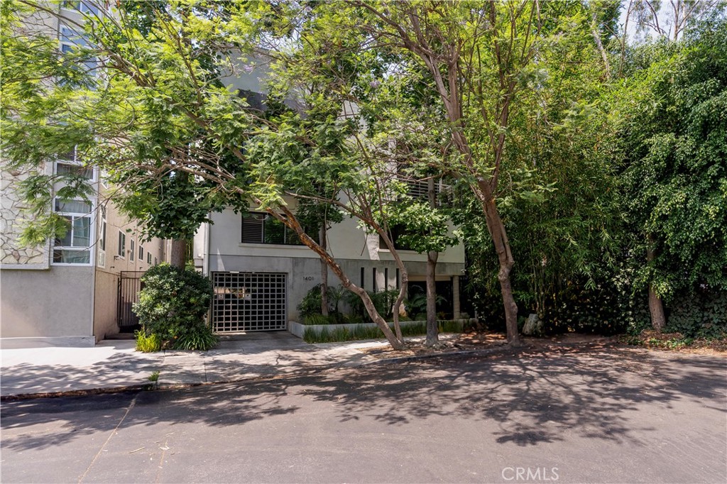 Wow! Finally! A rare opportunity to have it all! Architectural elegance meets modern luxury in this stunning townhome-style condo, designed by renowned architect William Hefner, AIA. Every detail of this residence has been thoughtfully curated, from the rich wood flooring throughout to the soaring ceilings and perfectly aligned balcony doors and windows that flood the space with natural light and offer serene tree-lined views, providing the ultimate in living area. The expansive primary suite is a true retreat, complete with a cozy fireplace and a luxurious en-suite bath featuring a soaking tub—ideal for relaxation or a refreshing cold plunge—along with a separate shower and double vanity. The second bedroom is perfectly suited for a nursery, guest room, or home office. The updated kitchen is both stylish and functional, and comes equipped with a refrigerator. Upstairs, a spacious third-level loft with its own bath opens to a private rooftop patio—perfect for a home office, morning yoga, or hosting friends under the stars. Beyond the beautiful interior and flexible floor plan, this Westwood home’s location is ideally nestled at the end of a cul-de-sac and is within the highly rated Fairburn elementary school boundaries. You’re blocks from Trader Joe’s, Whole Foods, coffee shops and boutique shopping, dining in the Westwood Village and renown Sawtelle blvd. Additional highlights include end unit, no one above and no one below, central A/C, in-unit laundry, two-car parking with an EV charger and a stand alone storage area. A rare opportunity not to be missed—where architectural pedigree, comfort, and convenience converge.