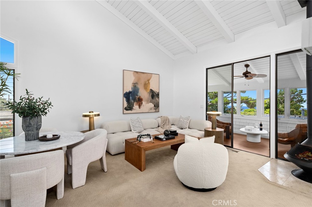 Iconic coastal living comes to life in this classic South Laguna cottage, set moments from the vibrant South Laguna Village and the pristine sands of Table Rock Beach. Thoughtfully positioned on an elevated corner lot, the home captures sweeping ocean views from both levels and features a generous front deck designed for effortless outdoor living. Inside, the airy open-concept design spans approximately 1,089 square feet, complemented by an additional 123-square-foot enclosed patio. Vaulted ceilings enhance the sense of space, while the main level showcases an open kitchen with bar seating—perfect for casual dining and entertaining. Two bedrooms and two bathrooms are thoughtfully arranged, including a spacious primary suite on the main level. Outdoors, the property is framed by colorful landscaping and offers parking for two in the garage, plus additional driveway parking. Enjoy proximity to world-class resorts such as the Montage, picturesque coves, sandy beaches, and Laguna’s renowned collection of galleries, boutiques, and dining destinations. An exceptional opportunity—perfect as a main residence or a second home.