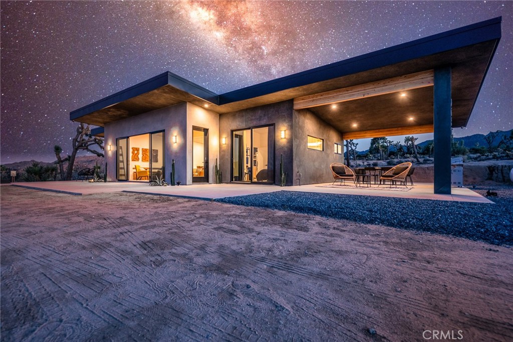 Luxury Desert Oasis – Fully Furnished & Move-In Ready.
Welcome to 6737 Saddleback, a breathtaking Joshua Tree retreat that seamlessly blends modern elegance with the raw beauty of the desert. This turnkey sanctuary is fully furnished with $30,000 worth of high-end pieces from Article, Castlery, West Elm, Citizenry, and local artists, ensuring a space that is both sophisticated and inviting.
Step into two lavish king suites, each featuring private en-suite baths, premium Nectar mattresses, and ample storage, creating a tranquil escape designed for ultimate comfort. The heart of the home is its gourmet kitchen, outfitted with a brand-new refrigerator, gas cooktop, oven, dishwasher, top-tier HexClad cookware, and All-Clad appliances, making meal preparation an absolute delight.
Outside, immerse yourself in the magic of the desert with a brand-new $20,000 hot tub, a propane firepit surrounded by Adirondack chairs, and an outdoor shower, allowing you to soak in the star-studded Joshua Tree skies in complete serenity.
Built with sustainability in mind, the home features durable concrete floors, high-efficiency heating and cooling in each room, and a design that ensures year-round comfort. Nestled just minutes from town, yet offering secluded privacy among native Joshua trees and cacti, this property is the perfect desert escape—whether you're seeking relaxation, adventure, or inspiration.
Don’t miss the opportunity to experience the pinnacle of desert living in this exquisite, fully furnished retreat!
