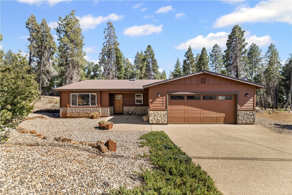 Looking for a fresh start in the pines? This one is it! Rebuilt in 2022 by well-known Chico builder Adam Birchard, this home brings quality, comfort, and a whole lot of style. The curb appeal is on point with its rock-and-stone front, custom front door, and easy-care landscaping (on drip!) that keeps things green without the hassle. Step inside and you’ll love the wide-open layout with a big living room up front and a cozy family room that flows right into the kitchen and dining nook—perfect for movie nights, game days, or casual dinners with friends.
The kitchen rocks stainless appliances, warm wood cabinets, and granite counters that shine. Throughout the home, you’ll find laminate floors, a pellet stove to keep you toasty, a Generac generator for peace of mind, and leased solar to keep the bills in check. Out back, no neighbors—just wide-open views of the disc golf course! Kick back on the oversized deck, fire up the BBQ, or just sip your coffee and soak it all in.
And the best part? The POA here is loaded with good vibes: a pool, spa/hot tub, tennis courts, picnic spots, hiking trails, and a clubhouse where the fun never stops.