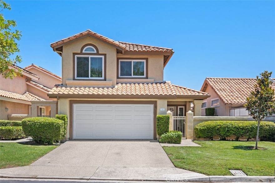 This elevated home located on the Coto de Caza's North Course with an incredible view of the 8th & 9th fairway and Saddleback Mountain will take your breath away! The dramatic stone entryway will lead you to this light and bright home with approximately 2100 square feet of living space. Hardwood flooring, crown molding and plantation shutters accent the well laid out floor plan. The light and bright kitchen with garden view window, granite counter tops, center island and built in Kitchen Aid refrigerator over look the golf inspired backyard. The joining Family room with fireplace is perfect for unwinding. Upstairs the Primary bedroom offers a view window with what seems like forever views and large walk-in closet. The newly updated bath with soaking tub accented with light stone and double vanity along with separate walk-in shower and commode area.  Nicely sized 2nd and 3rd bedrooms with customized closets, mirrored wardrobe doors, shutters and ceiling fans. Sitting high above the golf course with mountain views too, the beautiful pavers, retractable awning and patios will entice you all day long. NEW epoxy garage flooring, fresh paint and plenty of storage in garage is an extension of this well maintained home (washing machine and dryer included). The Terraces development also offers it's private pool and spa! Enjoy the Coto lifestyle with all the guard gated community has to offer- Walking/biking trials, sports parks & dog park. Coto de Caza Golf and Racquet Club membership offers golf, tennis, gym, pickle ball, spa and restaurants for an additional cost.