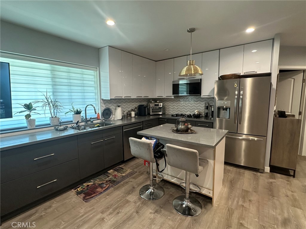 Newly built ADU. This studio was tastefully designed with a full size chefs kitchen, island and modern appliances. Modern bathroom, closet space and a murphy bed which folds up or extra space. Just bring your mattress. There is a private and secured access gate and entry from the side of the house. It is located on a quiet cul-de-sac street, in a very desirable and quiet neighborhood in Sylmar. Walking distance to Los Angeles Mission College, El Cariso Community Regional Park, and El Cariso Golf Course. Water, sewer, trash and gas are included. Tenant is only responsible for electricity and internet. Sofa and table sets are available and negotiable with an additional deposit of $500.