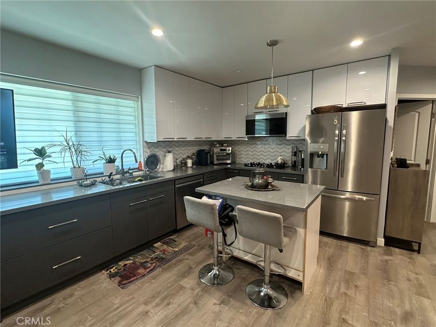 Brand New ADU. This studio was tastefully designed with a full size chefs kitchen, island and modern appliances. Modern bathroom, closet space and a murphy bed which folds up or extra space. There is a private and secured access gate and entry from the side of the house. It is located on a quiet cul-de-sac street, in a very desirable and quiet neighborhood in Sylmar. Walking distance to Los Angeles Mission College, El Cariso Community Regional Park, and El Cariso Golf Course. Water, sewer, trash and gas are included. Refrigerator and private washer dryer are included.  Sofa and table sets are also available. All you need is a mattress.