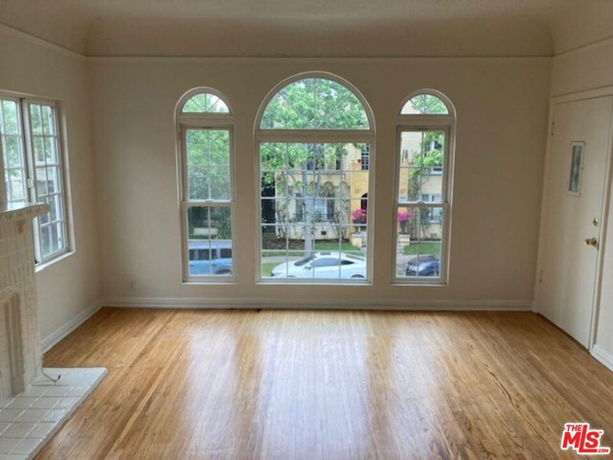 Do not miss!  Very spacious upper 2 bedroom/1 bath apartment in the best location north of Beverly Blvd. and just east of Fairfax.  Redone kitchen, formal dining room, central heat and air, laundry room inside, hardwood floors and carpet.  One surface parking spot in back and permit parking on street.