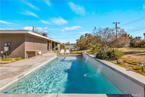 Photo of 56527 Bonanza Drive, Yucca Valley, CA 92284 (MLS # JT26021712)