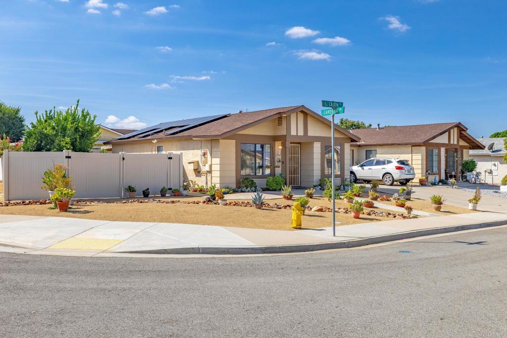 Charming 2-Bed, 2-Bath Home in the Premier 55+ Hermosa Community! Nestled in a quiet, well-established neighborhood, this beautifully maintained home offers comfort, style, and peace of mind. Featuring 2 spacious bedrooms and 2 bathrooms, and sits on a rare, large corner lot—boasting one of the biggest yards in the entire community, and includes solar to cut expenses. Step inside to discover a bright, open floor plan with dark cappuccino laminate floors throughout. Natural light floods the cozy family room from the large picture window and features a built-in wall unit for books, storage, decorations or a small television. The kitchen shines with granite countertops and backsplash, updated cabinetry, newer appliances and plenty of workspace for the home chef. Includes bright, spacious dining area. Both spacious bedrooms feature glass sliding door to the large covered patio and a beautifully landscaped backyard. Enjoy the privacy and tranquility of the oversized yard—perfect for gardening, entertaining, or simply relaxing outdoors. Mature, fruit-bearing citrus trees, beautiful garden pavers, new low-maintenance desert landscape and double-door swinging gate for easy access to the back yard. The neighborhood is renowned for its safety, cleanliness, and friendliness, boasting well-maintained homes, and low HOA. Washer/dryer hookups in garage, newer air-conditioner, newer roof, and brand new hot water heater. This is a wonderful opportunity to enjoy low-maintenance living in a lovely, vibrant, age-qualified community.