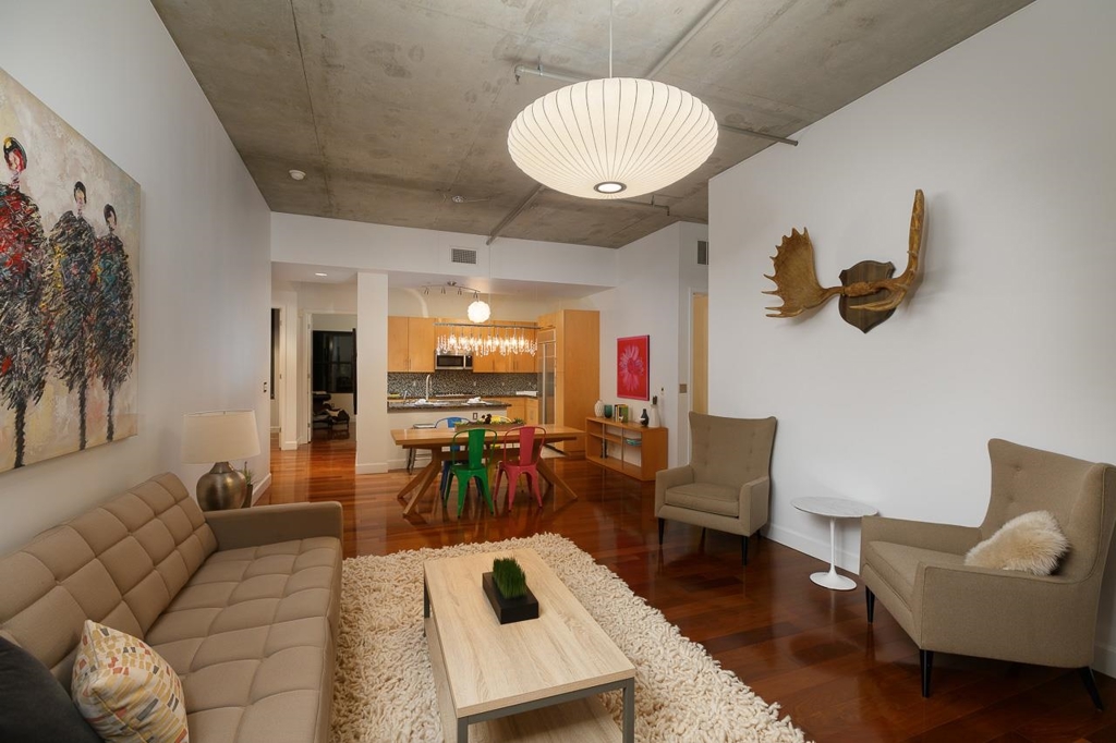 Elegantly upgraded M2i/East Village 2 Bedroom Plus Den Loft. Unique "Built Out Carriage" floor plan that flows from street to courtyard. Full bedrooms allow the design styles of a loft along with the functionality of a large condo. This loft Features: 11 foot exposed cement ceilings, East and West Facing windows for plenty of light, upgraded stainless kitchen appliances, contemporary lighting upgrades, tile in kitchen and baths, and beautiful wood flooring throughout living and bedrooms. Neighborhoods: East Village/Ballpark Complex Features: ,,,, Equipment: Dryer,Fire Sprinklers,Garage Door Opener, Range/Oven, Washer Other Fees: 0 Topography: LL