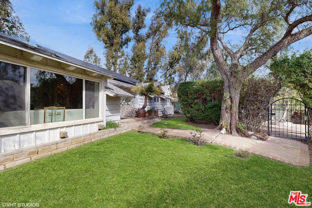 Imagine waking up to the California sun, surrounded by lush fruit trees, with the possibility of having your horses right on your property. This is more than a home; it's a lifestyle. Discover this exceptional single-story, 4-bedroom, 3-bathroom main house for lease in Malibu, featuring a private guest house and an array of luxurious amenities. The main house offers spacious living with a gourmet kitchen designed for the culinary enthusiast. You'll find a Viking cooktop, Miele coffee machine, stainless steel appliances, and elegant granite countertops. Step outside to your private paradise, where a brand new remodeled pool and spa invite relaxation. Sitting on just under 1 acre and zoned for horses, this property provides incredible versatility. A fully remodeled 1-bedroom, 1-bathroom guest house (or writer's bungalow/office) offers a private sanctuary with its own spa. The property boasts an abundant orchard with lemons, limes, avocados, peaches, plums, oranges, mulberries, apricots, and Fuji apples a true gardener's delight! Enjoy ultimate privacy and security with a fully gated property featuring two automatic gates and a spacious circular courtyard for guest parking. An electric charger is also on hand for your convenience.This is a rare opportunity to experience the best of Malibu living. Don't miss out on this unique property that blends luxury, comfort, and the tranquility of a sprawling estate.