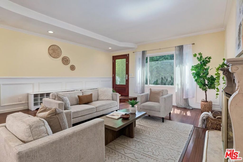 Gorgeous 2-story 4-Bedroom, plus Office & 4-Bathroom home in Culver City's Blair Hills near the Baldwin Scenic Overlook! This large 2268sf home has a huge grass yard, patio area and an in-ground swim spa/hot tub! The remodeled home has a large living room with hardwood floors, fireplace and formal dining area. The gourmet kitchen has white shaker cabinets, quartz counters, stainless steel appliances and a center island. The separate sunken living/TV/kid's playroom is ideal for large families! The home has 3-bedrooms & 3-Bathrooms upstairs. The primary suite has a beautiful spa-style bathroom with tiled shower, separate spa tub and dual sinks. The kids' rooms share a jack-&-jill bathroom. The downstairs guest suite, on the other side of the home, has wood-framed glass doors that open up to the backyard. The office provides additional storage space and would make a great gym or a potential 5th bedroom. The home has a new roof, new central air & heat and washer & dryer. Amazing location, surrounded by parks & hiking trails, near Blair Hills Park's sports courts & play area, the back entrance to the Baldwin Scenic Overlook trails, Stoneview Nature Center and the pedestrian bridge to the incredible Kenneth Hahn State Park! Close to everything in downtown Culver City, near Amazon & Apple offices! Great Westside location!