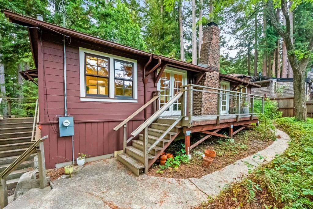 Escape to your cabin in the woods with this charming 2-bedroom, 1-bath home. Nestled among lush greenery, this home offers exceptional privacy and a peaceful retreat. The interior features an inviting eat-in kitchen and a light-filled living room with two sets of French doors that open onto a spacious deck. The office/bonus room provides additional space spread-out. Located less than half a mile from the iconic Alice's Restaurant, this property combines rustic charm with unbeatable convenience. Whether you're seeking a weekend getaway or a full-time residence, this cabin offers a rare opportunity to live immersed in the beauty of the redwoods while remaining close to the amenities of Redwood City and nearby Silicon Valley. ***No street parking. When visiting the property, please park in the driveway.***