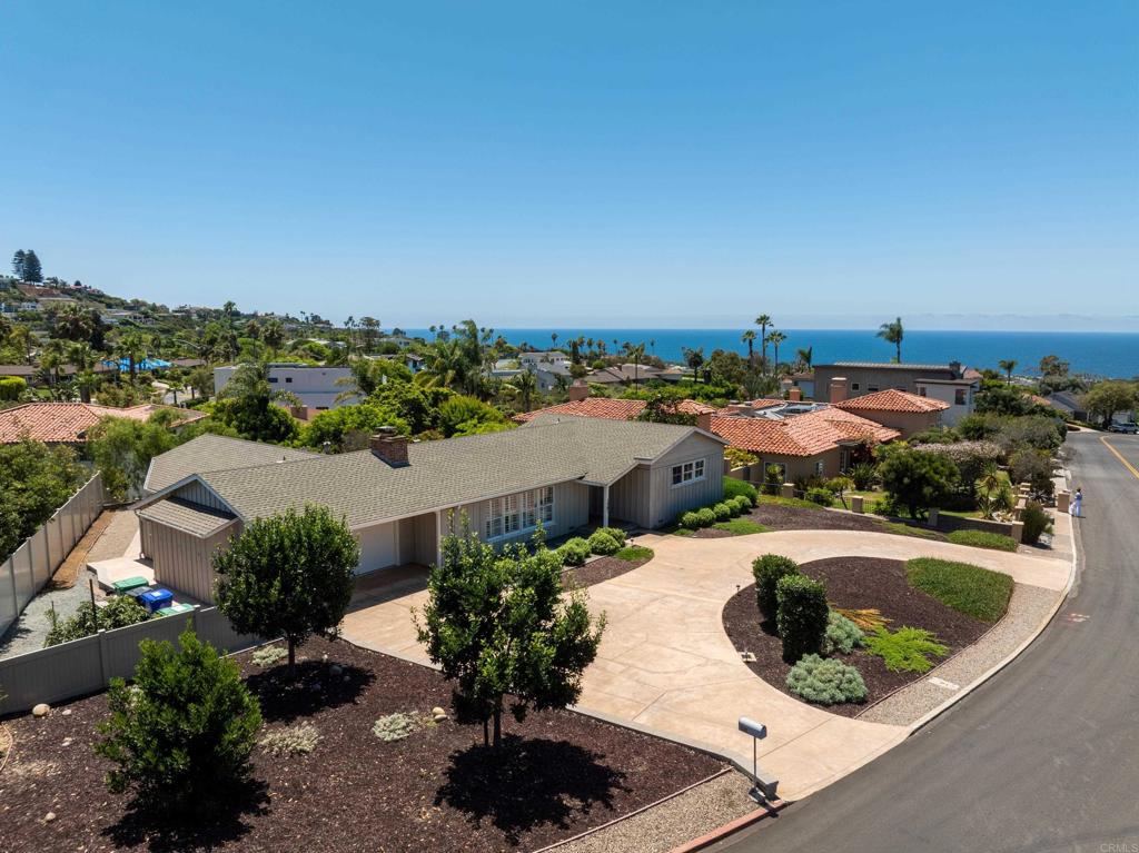 This prime opportunity offers single-level living with horizon ocean views from the front & rear yards and is just a few minutes from the Village, beaches and top-rated schools. This vintage home includes charming features like open beamed ceilings, brick fireplace and wood board-and-batten siding, and is undersized for the generous, mostly flat 0.3 acre lot, offering incredible potential for personalizing or complete reimagining - including the option to add a second story to fully capture the ocean views. A crescent-shaped driveway and front facing garage provide ample parking and a buffer to the street exposure. With a little vision & creativity, this can be transformed to its full potential and will be an opportunity missed if not acted on urgently!