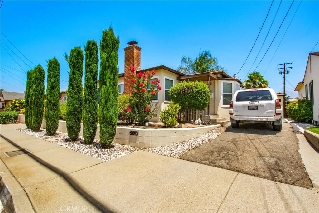 Big Price Improvement! Welcome to 2685 Arrow Highway, an exceptional investment and multi-generational living opportunity nestled in the heart of La Verne. This versatile property features a beautifully maintained 2-bedroom, 1-bath front home of approximately 900 sq ft, complete with central air conditioning, a private yard, and parking for three vehicles—currently generating $2,800 per month in rental income.
Set behind the main residence is a recently built, fully permitted 2-bedroom, 1.5-bath ADU (approx. 648 sq ft, built in 2021), offering modern amenities such as central air, a private rear yard with a flourishing orange tree, BBQ area, patio, and garden, as well as granite kitchen counters and a convenient stack washer/dryer. The ADU also enjoys direct access to a detached, permitted 200 sq ft bonus room at the rear of the garage—ideal for use as a studio, office, or guest suite, featuring independent heating and air with potential for a future bathroom addition. The property now comes with two overnight annual street parking permits which, combined with the two parking spots on the driveway, provides ample parking for both units!
Both homes benefit from 21 owned solar panels, dramatically reducing monthly electricity bills and to be fully paid off at close of escrow, ensuring long-term savings and energy efficiency. With a flexible layout, private outdoor spaces for each dwelling, and proximity to top-rated Bonita Unified schools, this property is perfect for families, investors, or anyone seeking strong income potential and versatile living in a highly desirable neighborhood.
Enjoy a convenient lifestyle with just a 10-minute walk to the new La Verne/Fairplex Metrolink station, offering easy access to Pasadena and downtown Los Angeles, and enhancing commuter and tenant appeal.