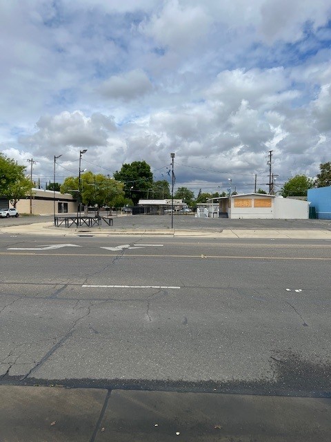 Super location on West 16th Street (Merced's primary east-west arterial in Central Merced) and 1-block west of G Street (Merced's primary north-south arterial). Parcel is fully paved and has light poles illuminating the lot. Property has a doublewide modular sales office with 16' x 30' storage shed abutting on the east side and a 48' x 8' covered porch abutting on the west side. Currently leased for $2,618.66 NNN but Tenant will vacate if Buyer wants possession. Great exposure and ideal location for a car lot.