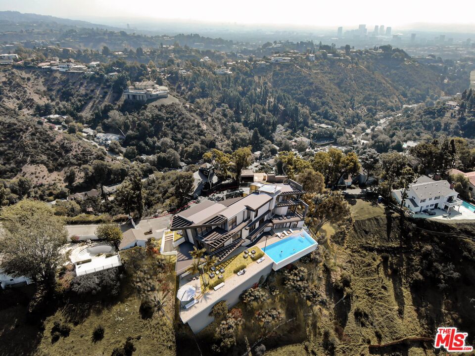 This new construction masterpiece under construction blends exceptional design with refined comfort with modern touches throughout. One of the best views in all of Los Angeles with uninterrupted panoramic ocean, city, downtown LA and canyon views. Property being sold in course of construction, "AS IS". Once completed, the finished Estate will be closer to $52,000,000