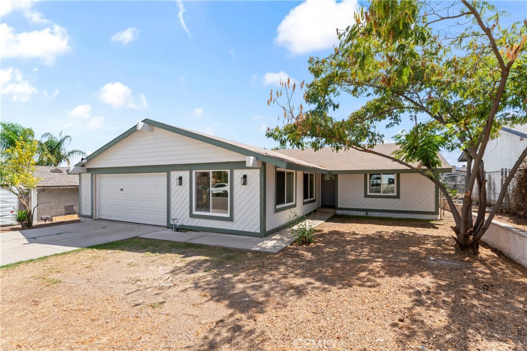 Beautifully fully renovated 3 bedroom, 2 bath home in the desirable Quail Valley community, just minutes from the 15 and 215 freeways, shopping, Lake Elsinore, and Canyon Lake. This home features an inviting open floor plan with wood-like vinyl flooring, fresh paint, and a spacious living area highlighted by a corner brick fireplace. The brand new kitchen boasts calcutta marble countertops, new soft close hinges cabinets, and elegant gold hardware, combining style and function. The home offers two comfortable bedrooms plus a main suite, which features a private bathroom with designer finishes and a sliding glass door leading to the backyard. The living area also provides direct backyard access through another new sliding glass door, creating a seamless indoor-outdoor flow. Upgrades include all new dual-pane windows, new sliding doors, new interior doors, and a stunning new front door, as well as a new central AC system. The bathrooms showcase a designer touch with modern gold fixtures with a spa like feel, adding elegance throughout. The spacious backyard with a deck is perfect for entertaining, while the 2-car garage with a new door adds convenience. An additional non-permitted room (19.5’ x 9.5’) with double-entry doors offers flexibility as a home office, gym, or playroom. This is a must-see home blending modern design, comfort, and a great location ready to welcome its new owners!