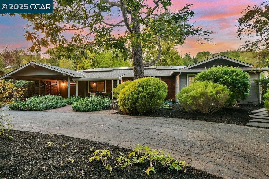 Discover this stunning 4 Bedroom, 3 Bathroom single-story home nestled in a serene, wooded setting. This home offers an open & inviting floor plan with ample storage throughout. The Kitchen is a dream with an island featuring a gas cooktop, abundant cabinetry, built-in oven & microwave & sink overlooking the yard—perfect for cooking while enjoying the scenery. Relax in the living room with a cozy wood-burning fireplace.  Entertain in the large bonus/family room equipped with a bar area with sink, mini fridge, kegerator, built-in desk, plus direct access to the yard & additional storage or a gardening workshop space. The private primary suite includes built-in cabinets, a spa-like bathroom with dual sinks, a walk-in shower, soaking tub, & even space to enjoy your favorite shows while you unwind. Step outside to your private backyard oasis featuring a turf lawn, fire pit area, electric spa, gardening beds, & a sand pit, all surrounded by mature greenery & tranquil creekside views. Enjoy the everlasting memories created here! Recessed lighting, dual-pane windows, Hardwood Floors & thoughtful storage! OWNED SOLAR. Set back from the street with a circular driveway with ease for parking. Zoned for Lafayette located near shopping, Hwy 24/680 & Bart. OPEN HOUSE SUNDAY 10/12, 2:30-4:30PM