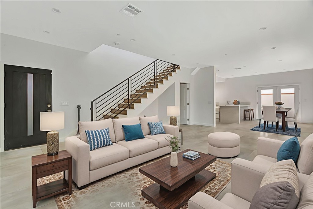 This beautifully updated single-family residence offers a versatile and income-generating setup in a prime North Hollywood location. The main house, located at the front of the lot, features 3 spacious bedrooms and 3 full bathrooms, designed for comfort and modern living. At the rear of the property sits a private and fully detached 2-bedroom, 2.5-bathroom Accessory Dwelling Unit (ADU), complete with its own address, separate utility meters, and private entrance — making it ideal for rental income, extended family, or a guesthouse. The ADU is currently vacant and move-in ready. Step outside to discover your own private oasis! The beautifully landscaped backyard boasts a sparkling pool, perfect for relaxation and fun in the sun. The outdoor space is ideal for hosting summer barbecues or simply unwinding after a long day. Don’t miss this exceptional investment or multi-generational living opportunity in one of the Valley’s most desirable neighborhoods.