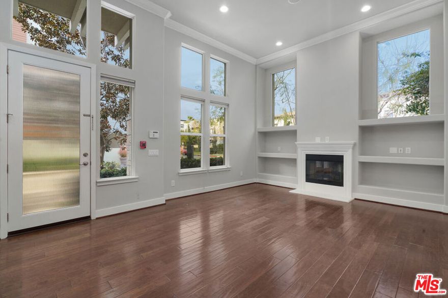 Be captivated by this chic and contemporary corner unit in one of Playa Vista's best complexes highlighted by exquisite finishes and state-of-the-art amenities. Bathed in natural light and upgraded to perfection, this 2 bedroom 3 bath plus den/media room with built-in surround sound is a treat for the entertainer who demands space and quality in an unparalleled locale can be used as a 3rd bedroom. Stainless steel appliances including a Viking cook-top, maple cabinets, granite center island, built-in wine refrigerator, and marble floors enhance the dramatic kitchen while French doors open onto the terrace which is perfect for al-fresco dining or intimate gatherings. A wall of towering casement windows punctuates the spacious living room featuring gleaming hardwood flooring and gas fireplace, and the glamorous primary suite is warmed by a gas fireplace and offers a seductive marble bath with dual vanities and a large walk-in closet. The 2nd en suite bedroom will not disappoint and tucked away downstairs is the media and laundry rooms with side by side washer/dryer and direct access 2-car garage. Designer details include crown moldings, tasteful ceiling fans, recessed lighting, and custom window coverings throughout. Enveloped by a plethora of restaurants and shops/Whole Foods Market at the Runway combined with exclusive access to the main clubhouse, numerous pools and recreation center.