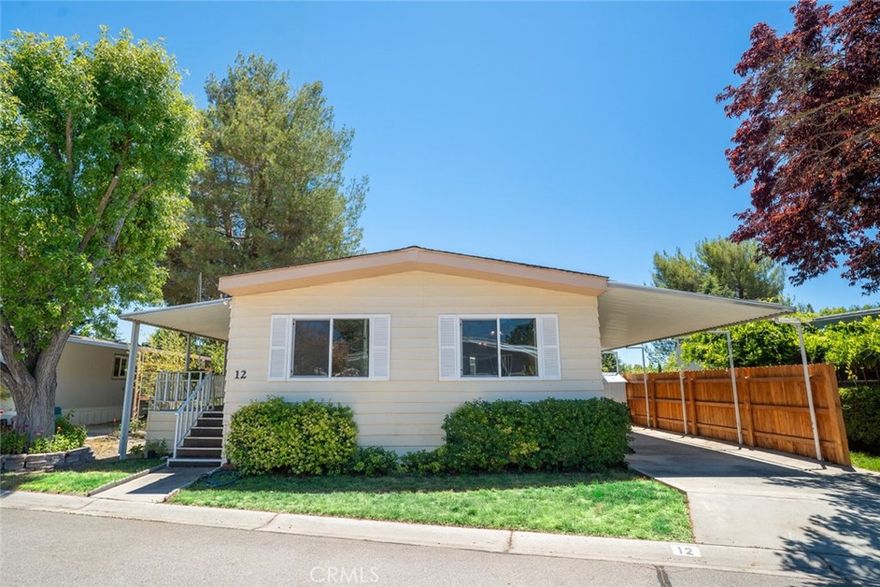 Own Your Land!

Welcome to 12 Via Santa Barbara, a charming, well-maintained home in the desirable Rancho Paso 55+ community. Enjoy the benefits of land ownership and an active lifestyle without space rent.This spacious ~1,344 sqft 2 bedroom 2 bathroom home features an open-concept layout filled with natural light. The bright kitchen perfect for entertaining and a reverse osmosis system. The private primary suite is a peaceful retreat, complete with an en-suite bathroom and an oversized soaking tub.Outside, a covered front porch offers a relaxing spot for coffee in the mornings. Interior has recently been paintedThe low-maintenance exterior includes a large storage shed at the rear of the property. Rancho Paso is known for its friendly atmosphere and amenities such as two clubhouses, a swimming pool, walking parks, and social events year-round all located in the heart of Paso Robles wine country.If you’re seeking low-maintenance living with great amenities and ownership of your land, this home is a perfect fit. Don’t miss your chance schedule a tour today!