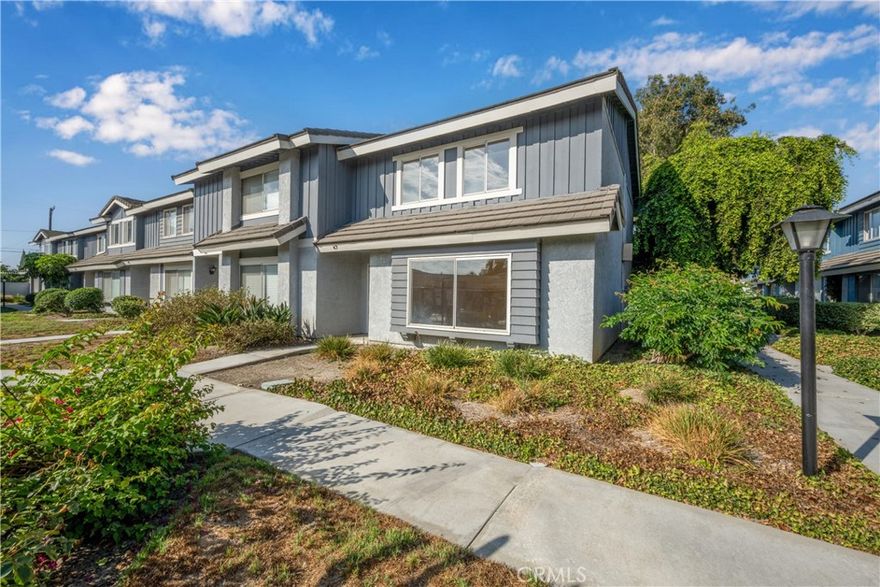 Glenbrook Artesia, Prime location end unit, steps from the sparkling community pool and spa. This 3-bedroom, 2.5-bath townhome offers the perfect blend of comfort and convenience. Freshly painted throughout, this two-story home welcomes you with a bright and spacious living room and a convenient half bath on the main level - ideal for guests. The kitchen features an LG stainless steel refrigerator, stainless steel dishwasher, and electric stove. It opens to a cozy family room or dining room, creating an inviting space for everyday living and entertaining. Upstairs, you'll find all three bedrooms and two full baths, including a master suite with dual sinks and a brand-new glass shower door for a modern touch. Enjoy your own private patio with direct access to the two-car garage, complete with laundry hookups. Centrally located near the 91, 5, and 605 freeways, and close to shopping, dining, and more - this is Southern California living at its best!