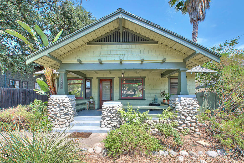 Nestled in the prestigious and highly coveted Bungalow Heaven Historic District, this exceptional duplex residence offers a rare opportunity to own a piece of Pasadena's architectural heritage.The Front Residence is a striking Craftsman jewel, brimming with character and original details. A welcoming, expansive front porch sets the tone for what lies within. Step inside to a light-filled living room with gleaming hardwood floors, classic moldings, and multiple windows that bathe the space in natural light. The adjoining formal dining room is a showpiece, featuring original built-ins and a sparkling chandelier--the perfect setting for elegant dinner parties or intimate gatherings.The kitchen offers a tasteful blend of form and function, showcasing rich wood cabinetry and stainless steel appliances. The bathroom boasts a timeless clawfoot tub with shower, a classic pedestal sink, and charming period details. Two well-appointed bedrooms offer peace and privacy, while a dedicated laundry and storage room adds to the home's convenience. Step outside to discover a private backyard oasis.The Rear Residence offers its own unique appeal with a warm, traditional layout and updated finishes throughout. The open-concept living and dining area provides flexibility and flow, complemented by stunning wood floors and generous natural light. The modernized kitchen is a delight, featuring granite countertops, a tiled backsplash, stainless steel appliances, and an in-unit washer and dryer for added ease.The updated bathroom is thoughtfully appointed with a new vanity, toilet, and tasteful tilework. Both bedrooms are generously sized, each with spacious closets and stylish lighting fixtures. Step outside to your own private retreat--a serene brick patio shaded by a majestic oak tree, perfect for relaxing with friends, entertaining guests, or simply enjoying a quiet afternoon outdoors.This stunning duplex has been freshly painted outside and each unit includes its own private garage plus additional parking in the driveway.With an enviable Walk Score of 87, you'll enjoy effortless access to the best of Pasadena--local parks, charming cafes, the public library, fine dining, grocery stores, and more--all just moments from your doorstep.Whether you're seeking a luxury income property, a multigenerational living solution, or the perfect owner-occupied duplex with rental income potential, this Bungalow Heaven beauty is truly a rare find.