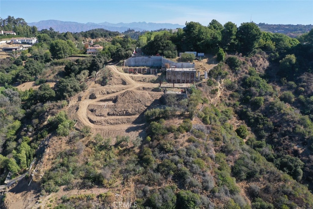 Beverly Hills Luxury Estate Site Hits the Auction Block! Don't miss the bankruptcy auction of one of Beverly Hills’ most coveted development sites: a spectacular estate in the exclusive, guard- gated Bella Vista Estates. This is a rare opportunity for a homeowner, investor or developer to build a one-of-a-kind estate in one of Los Angeles’ most exclusive enclaves. The 3.2-acre site includes detailed architectural plans for a 25,000+ s.f. ultra luxury estate. Designed for elevated living and grand scale entertaining, the planned estate features 5 Bedrooms, 2 Guest or Staff Suites,8 Full Bathrooms, 7 Half Bathrooms, 11 Car Garage, Private Theater, Gym with Spa, Wraparound Pool, and Expansive views of hills and valleys towards Beverly Hills.
The guarded community of Bella Vista Estates is truly one of the most private, secure and prestigious enclaves in Los Angeles. With gorgeous architectural plans, grading underway, and panoramic views, this site is ready for a visionary buyer to bring a luxury estate to life quickly. Due diligence materials, court approved Bid Procedures, and property information are available upon request