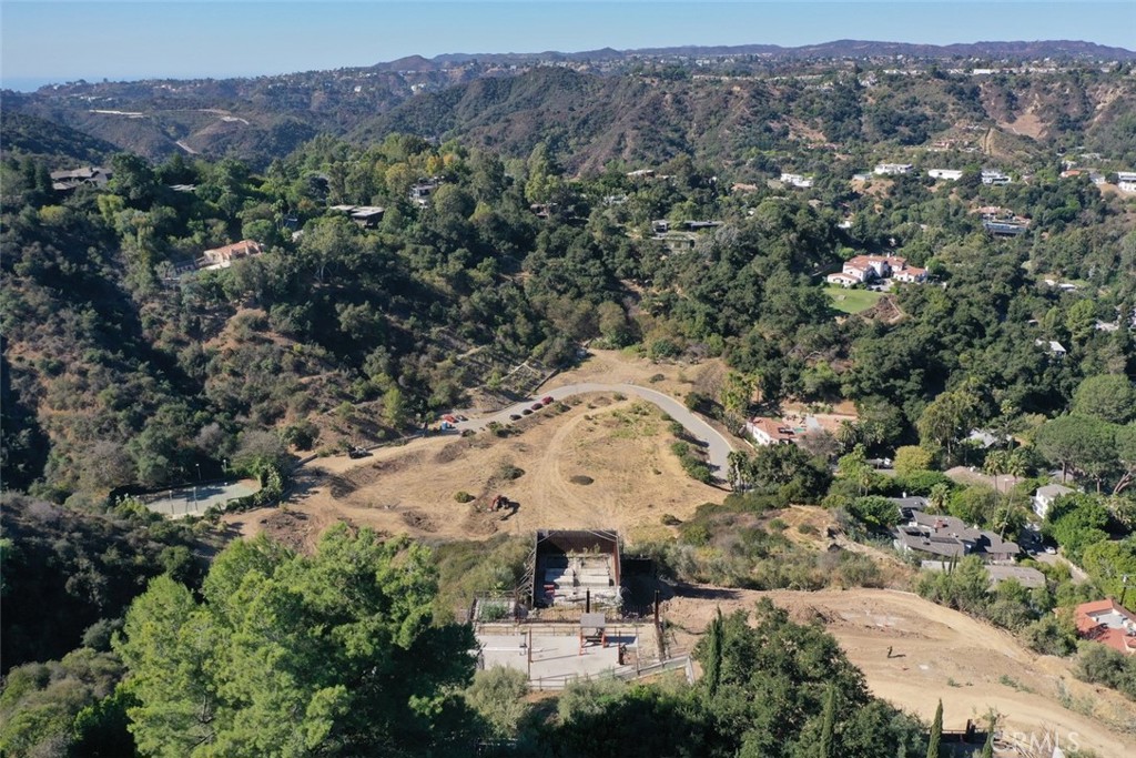 Beverly Hills Luxury Estate Site Hits the Auction Block! Don't miss the bankruptcy auction of one of Beverly Hills’ most coveted development sites: a spectacular estate in the exclusive, guard- gated Bella Vista Estates. This is a rare opportunity for a homeowner, investor or developer to build a one-of-a-kind estate in one of Los Angeles’ most exclusive enclaves. The 3.2-acre site includes detailed architectural plans for a 25,000+ s.f. ultra luxury estate. Designed for elevated living and grand scale entertaining, the planned estate features 5 Bedrooms, 2 Guest or Staff Suites,8 Full Bathrooms, 7 Half Bathrooms, 11 Car Garage, Private Theater, Gym with Spa, Wraparound Pool, and Expansive views of hills and valleys towards Beverly Hills.
The guarded community of Bella Vista Estates is truly one of the most private, secure and prestigious enclaves in Los Angeles. With gorgeous architectural plans, grading underway, and panoramic views, this site is ready for a visionary buyer to bring a luxury estate to life quickly. Due diligence materials, court approved Bid Procedures, and property information are available upon request
