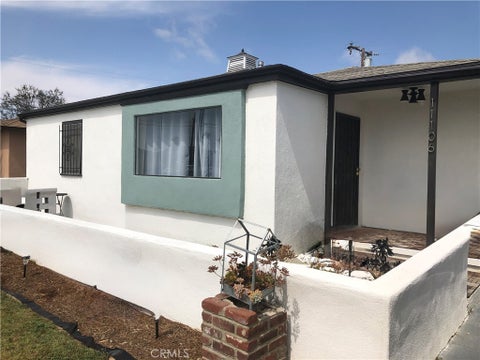 Photo of 11106 S Harvard Boulevard, Los Angeles, CA 90047 (MLS # SB26203177)