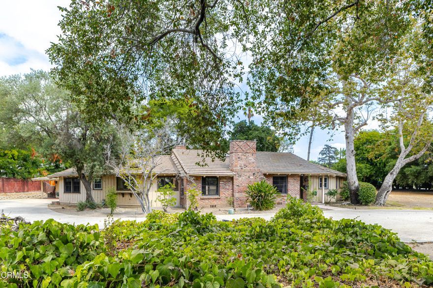 Set on a sweeping corner lot, this 4-bedroom, 3-bathroom ranch-style home offers spacious living and timeless California charm with fresh interior paint and flooring. The living room features vaulted ceilings, hardwood floors, and a decorative brick fireplace, while the adjoining family room includes shiplap paneling, a built-in bar, and a decorative indoor grill. The kitchen retains its original character with a vintage diner-style booth and updated stainless steel appliances. The private bedroom wing includes a generous primary suite with garden views, double closets, and an en suite bath with a corner tub and glass-enclosed shower. Sliding glass doors open to an expansive backyard with mature trees, a sport court, and room to relax or play. Board-and-batten siding and whimsical details complete this classic home. Conveniently located to nearby Trader Joe's, Grocery Outlet, H Mart, and Clairbourn School. Available for a 12-month lease.