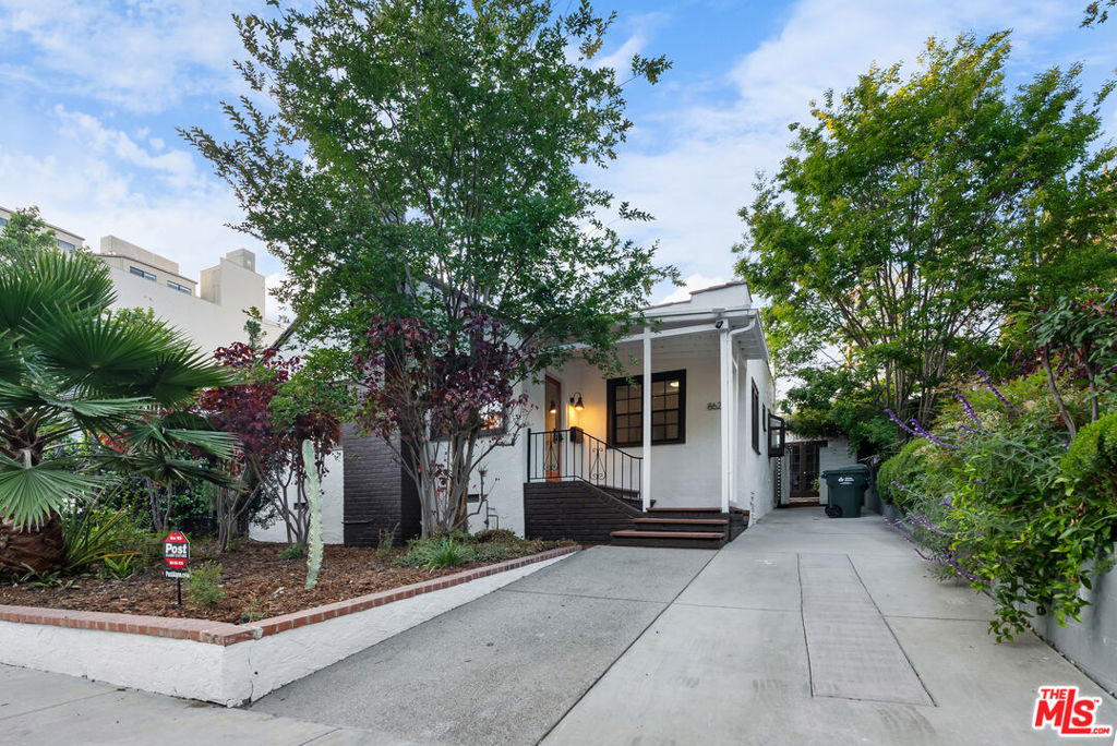 Charming 2-bedroom, 1-bathroom home that blends the warm, rustic appeal of Spanish architecture with the sophisticated elegance of London design. Nestled in the vibrant heart of West Hollywood, this unique abode offers a tranquil escape with its serene Zen backyard. The versatile back house presents the ideal opportunity for conversion into an ADU, providing additional living space or income potential. Picture yourself unwinding in the bubbling jacuzzi or hosting memorable gatherings. One block from Santa Monica Blvd, just a few blocks from Melrose, walking distance to the Sunset Strip.