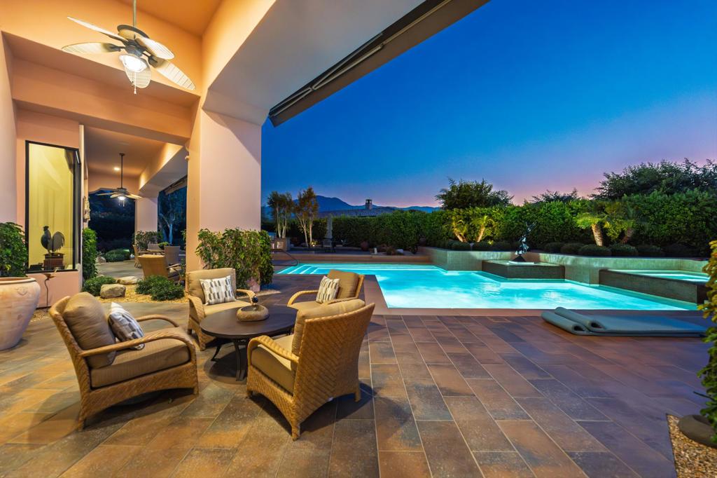 This magnificent former model estate in Griffin Ranch offers resort-style living with an impressive blend of elegance and comfort. Spanning approx. 5,009 sq. ft. with 4 Bedrooms & 4.5 Baths, this highly upgraded home is packed with luxury features.Enter through a beautifully designed front courtyard with fireplace and into a spacious great room with fireplace, disappearing doors, and custom window coverings. The open-concept gourmet kitchen is a chef's dream, featuring a Wolf stove, two Asko dishwashers, Sub-Zero appliances, and a bar refrigerator, all complemented by travertine flooring and a generous dining area.Enjoy evenings in the formal dining room, state-of-the-art media/TV room (easily convertible to a 4th bedroom), or unwind in the spacious master suite, showcasing pecan wood flooring, fireplace, a spa-inspired bath with dual vanities, and a custom walk-in closet with built-ins.A separate guest casita adds flexibility and privacy. Step outside to your private oasis with a saltwater pool and spa, built-in BBQ island, and expansive patio with ceiling fans--perfect for entertaining. The professionally landscaped yard features high-end artificial turf, a large putting green, and a sand trap for golf enthusiasts.Additional upgrades include a wine cellar, epoxy-coated 3-car garage floors, built-in garage cabinetry, and designer paint throughout. Offered partially furnished.