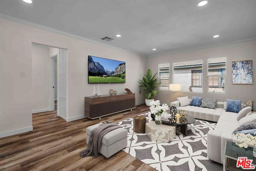 Bright and airy 2 bedroom, 1 bathroom apartment in a beautiful 1940s 4-unit building.  This upper rear 2bedroom 1 bath unit with Central heat and a/c.  New kitchen and bathroom.  New wood floors. 1-car carport.GREAT location min to studio city, studios ,sub way, bus lines