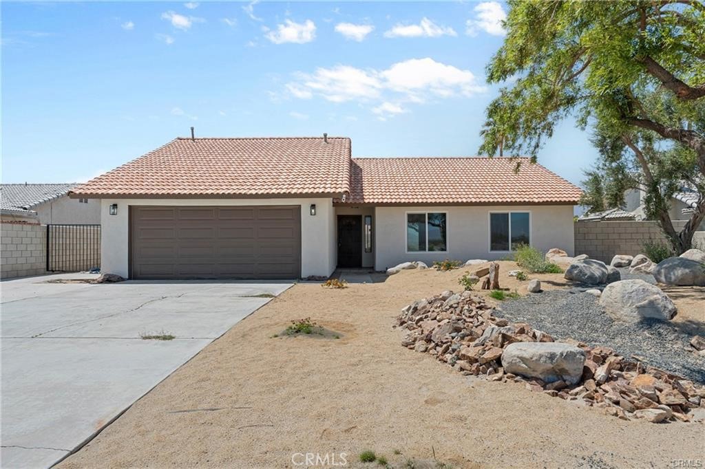 Welcome to this beautifully UPDATED 3-bedroom, 2-bath single-family home, offering 1,477 sq. ft. of thoughtfully designed living space on a spacious 7,841 sq. ft. lot. This home combines classic charm with modern upgrades throughout. Step inside to an open-concept layout featuring a rock-designed fireplace, FRESH paint throughout whole house, NEW fans and fixtures throughout, NEW LVP FLOORING in the main living areas, and NEW carpet in all bedrooms. The fully REMODELED kitchen shines with NEW quartz countertops, a LARGE walk-in pantry. Fully REMODELED master bedroom and bathroom with a walk-in closet. Enjoy energy efficiency and comfort with BRAND NEW dual-pane windows, NEWER blown-in insulation, and UPDTED ducts. The master suite includes a NEW sliding glass door that opens directly to the EXPANSIVE backyard, ideal for relaxing or hosting gatherings. Additional highlights include a freshly NEW STUCCOED exterior, a beautifully NEWLY landscaped front yard with a NEW drip irrigation system, and a 2-car garage with direct access. This turnkey property truly has it all—space, style, and upgrades in all the right places.