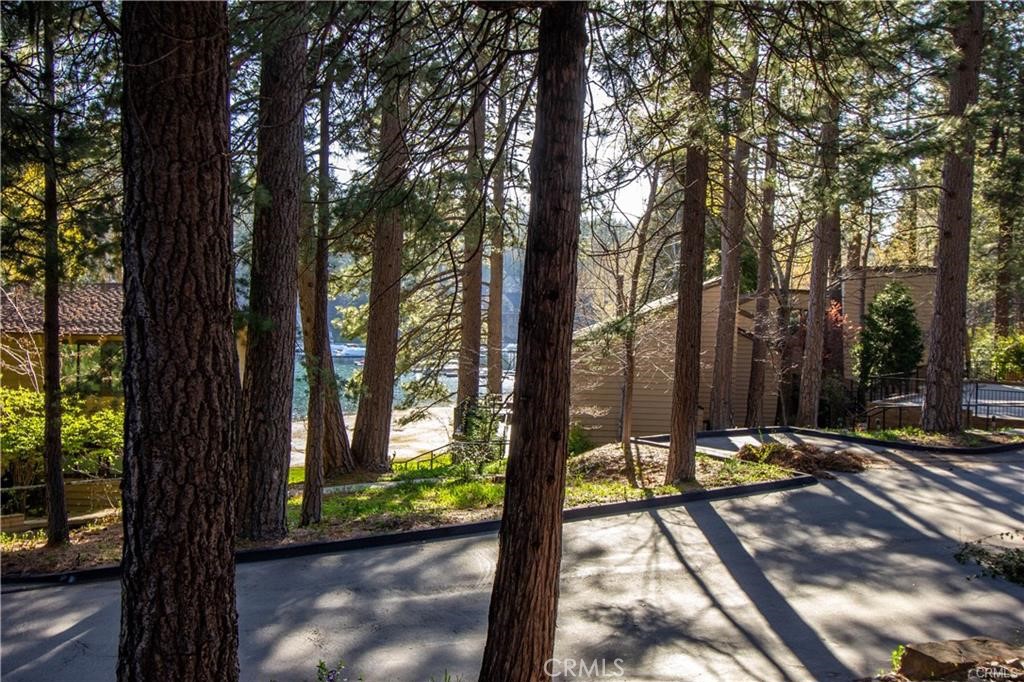 Rare Opportunity to own a lovely lake front property on Lake Arrowhead in the highly sought after Meadow Bay North Community.
This stylish and updated 1300 sq. ft. town home sits on a prime corner lot.
The house is literally a 3-4 minute walk to the largest sandy beach on the lake.
You can see close up views of the lake from the 2 balconies and a new double paned 120” x 60” picture window in the open kitchen dining, and living room area.
Come experience the peace and quiet of the lovely coniferous garden. Walking on the winding lighted sidewalks on the lake front property is breathtaking.
Call Nikki Howard today to schedule a viewing.