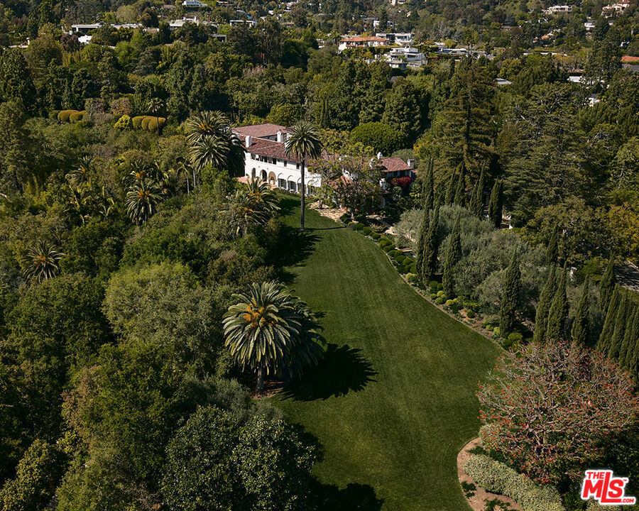 This property sits right in the heart of prestigious Bel Air, perfectly positioned on the 50-yard line. Spanning two plus breathtaking acres in Holmby Hills, it's a serene sanctuary surrounded by lush greenery, towering redwoods, and charming, winding pathways. With a tennis court and a beautifully restored vintage cabin, it offers the perfect blend of luxury and tranquility, all just moments away from the vibrant energy of Los Angeles.