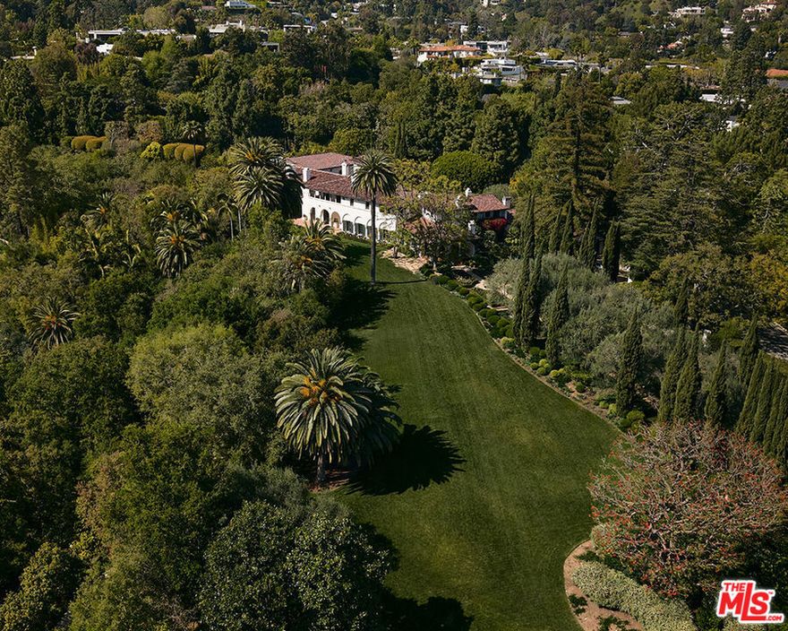This property sits right in the heart of prestigious Bel Air, perfectly positioned on the 50-yard line. Spanning two plus breathtaking acres in Holmby Hills, it's a serene sanctuary surrounded by lush greenery, towering redwoods, and charming, winding pathways. With a tennis court and a beautifully restored vintage cabin, it offers the perfect blend of luxury and tranquility, all just moments away from the vibrant energy of Los Angeles.