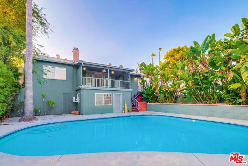 Charming midcentury ranch style home with pool and bonus studio available for lease. Located on a quiet street in the hills of Eagle Rock, this light filled 1950s home welcomes you with an open floor plan that extends to a spacious covered patio overlooking the inviting pool, terraced backyard, and lush canyon views. On the main level of the home, you will find two bedrooms, one full bathroom and laundry. The stylish galley kitchen offers stainless steel appliances, including dishwasher, refrigerator, cooktop, and double oven. Through the kitchen door an exterior staircase leads to the lower level of the property where you will find a separate bonus space with 3/4 bathroom - perfect use as a studio or home office. Enjoy the feeling of canyon seclusion and privacy while only minutes from the local cafes, shops and restaurants that Eagle Rock has to offer.
