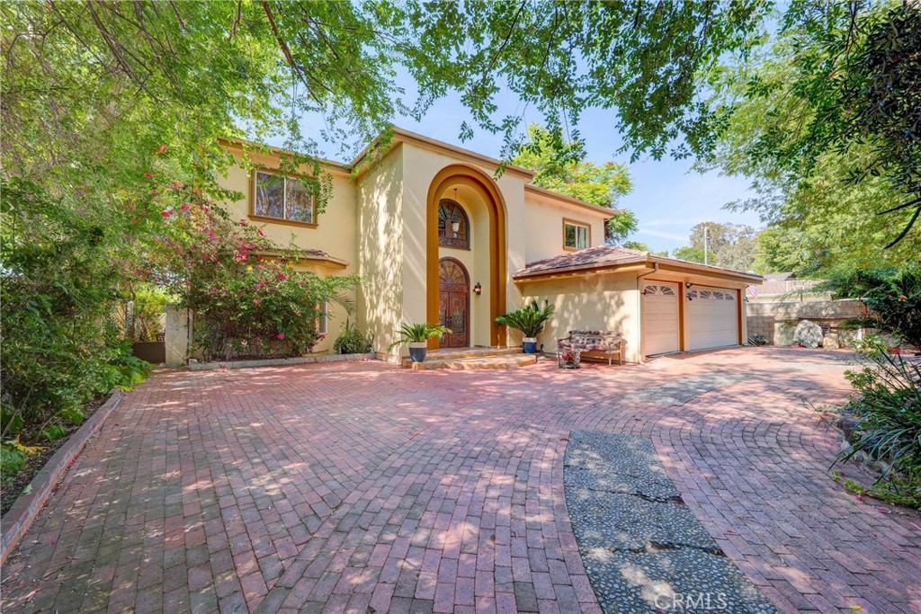 Set on a quiet, tree-lined street, this stunning 6,250 sq ft residence, rebuilt in 2007, sits on a sprawling 22,804 sq ft lot. Designed for both luxurious living and seamless entertaining, the home features 6 bedrooms, 7.5 bathrooms, and a flexible bonus room—two bedrooms and the bonus room are conveniently located on the main level.
Enter through grand double doors into an impressive foyer with vaulted ceilings, elegant crown molding, and a formal living room with a striking marble fireplace. The gourmet kitchen, inspired by French design, includes custom European Craftsman cabinetry, granite countertops, a large center island, and high-end Sub-Zero and Wolf appliances. A cozy breakfast nook overlooks the expansive backyard with a sparkling pool—perfect for both entertaining and peaceful moments.
Enjoy the antique wrought-iron staircase which leads you to four spacious bedrooms, including the opulent primary suite with a private balcony, dual walk-in closets . Do not miss marble flooring throughout the first level, an integrated sound system, a fully gated semi-circular driveway, a 3-car garage, and energy-efficient solar panels. With a perfect blend of classic elegance and modern convenience, this home offers unparalleled living in one of Woodland Hills' most coveted neighborhoods. Owner may consider seller financing or lease options. The owner originally built this home for personal use, sparing no expense and using only the highest-quality materials and finest craftsmanship throughout.”
Do not miss it .