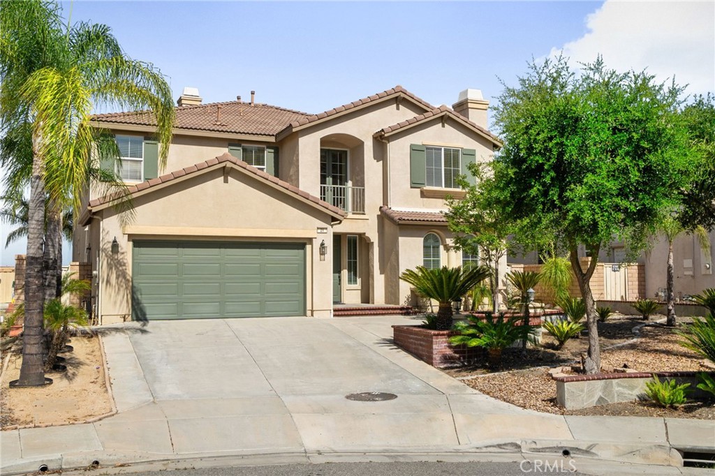 Welcome to your dream home in the highly desirable Tuscany Hills community. Situated at the end of a quiet cul-de-sac, this beautifully maintained two-story residence features five spacious bedrooms, four full bathrooms, and a convenient half bath—offering both comfort and flexibility for families of all sizes. The first floor boasts brand-new wood/laminate flooring and an abundance of natural light throughout. A private bedroom with a full bathroom on the main level is ideal for guests or multigenerational living, while a separate powder room adds extra convenience. The home offers both a formal living room and a cozy family room, each complete with its own fireplace—perfect for relaxing or entertaining. Upstairs, the expansive primary suite is a true retreat, showcasing stunning lake views, a luxurious soaking tub, stand-up shower, dual vanities, and a large walk-in closet. The second floor also features a spacious loft that can serve as a home office, media room, or play area. One of the upstairs bedrooms includes its own private full bathroom, while two additional bedrooms are connected by a Jack and Jill bathroom—providing both privacy and functionality. Step outside to your private backyard oasis, complete with a covered patio and a built-in BBQ island, ideal for outdoor dining and entertaining while enjoying peaceful lake views. The home also includes a generous three-car garage with one tandem/deep bay, offering ample space for storage, a workshop, or extra parking. As part of the Tuscany Hills community, residents enjoy access to resort-style amenities including a pool, spa, hot tub, fully equipped gym, picnic area, playground, and clubhouse. With convenient access to the 15 freeway, this home offers an ideal location for commuters and those seeking both comfort and convenience. This exceptional property blends space, style, and scenic beauty—don’t miss your chance to make it yours.