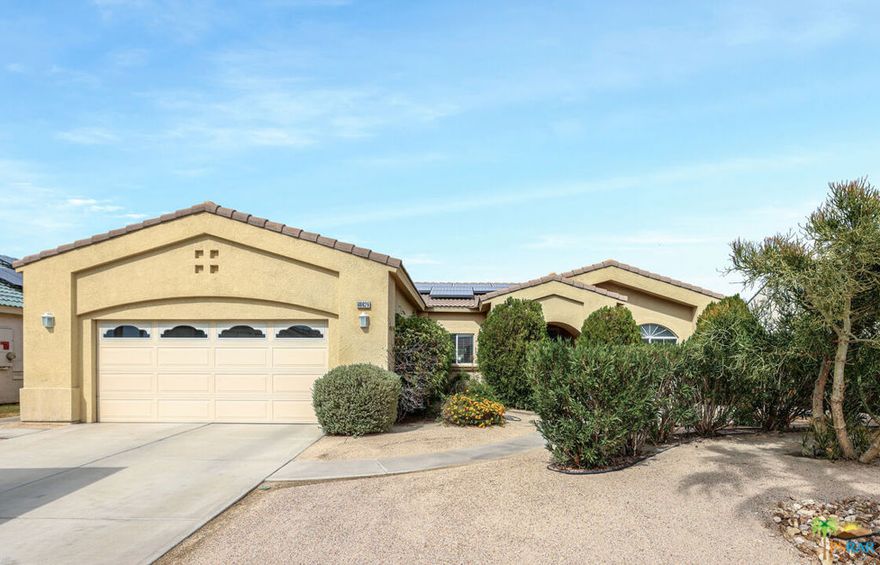 At last! A well priced home in the popular neighborhood of La Pasada. This one is exciting and filled with great opportunities.  3 bedrooms and 2 bathrooms.  Views of the painted mountains AND the San Jacinto peaks. Highly desirable open floor plan and access to the covered patio for ease of entertaining. Gorgeous travertine flooring in the public areas and lush carpeting in the bedrooms.  Newer stainless appliances in the BIG kitchen. Voluminous back yard with desert landscaping. Did I mention the views?  A secured fenced pet area (including fenced roof for their protection). Solar System providing LOW, LOW electricity costs.  This is the perfect home for you to snag and make it your next residence!