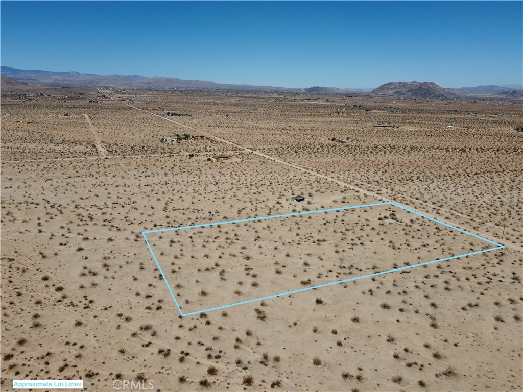 Owner is motivated! 5 acres on the Northern side of Joshua Tree! Possible well for water on the property per the owner, buyer to verify. Unobstructed views across the desert to mountains in the distance. Make this your personal camping spot under the stars or build your dream desert home! Partially fenced. Power adjacent to the property. Easy access on a good dirt road. Short drive to downtown shops, attractions, and amenities. Close to Joshua Tree National Park. APN: 0631-201-14-0000. Take a look at this one today!