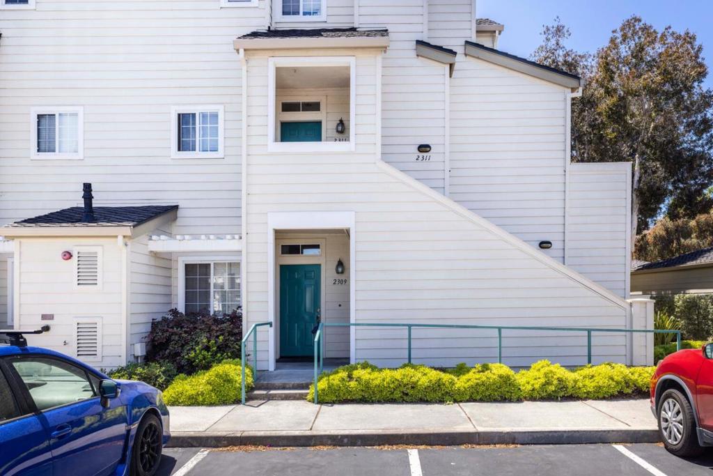 Conveniently located in the heart of Redwood Shores, this updated ground-level corner unit offers easy access to Hwy 101/92, Caltrain, Downtown San Carlos, Bay Club, and the scenic Bay Trail. Walk to The Marketplace at Redwood Shores, which has restaurants and shops including Nob Hill Foods, Starbucks, Mendocino Farms, Chipotle, Amicis, Five Guys, and more. This bright, one-level end unit features a spacious bedroom with bay windows and a walk-in closet, cozy fireplace with mantle, built-in custom wine rack, slate floors, designer paint, tile bathroom, and in-unit laundry. The gourmet galley kitchen has granite countertops and stainless steel appliances, with ample storage throughout, adding comfort and functionality. Enjoy a large private patio with two entrances from the living room and bedroom, perfect for relaxing or entertaining. Includes a detached one-car garage with storage. Community amenities include a pool and spa. A rare opportunity in one of the Peninsula's most desirable neighborhoods!