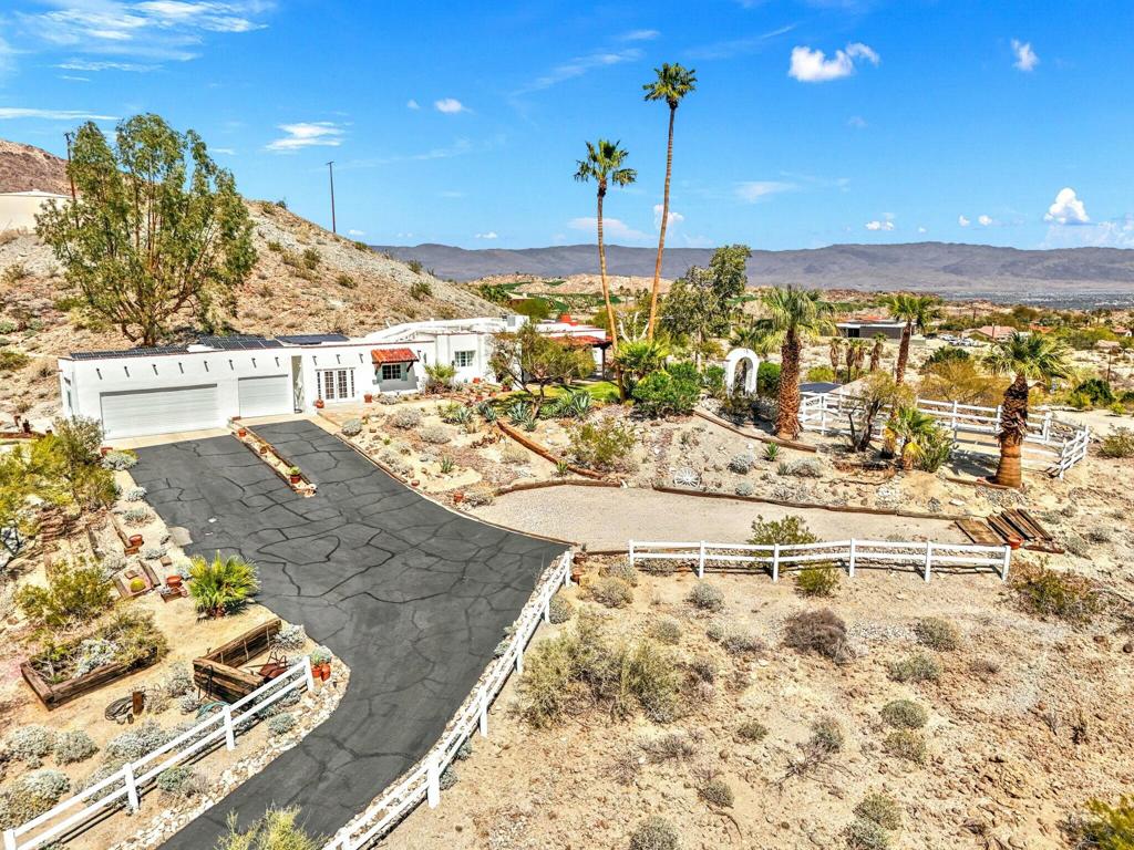 'Discover an unparalleled sanctuary within the prestigious Cahuilla Hills. This expansive 3.5-acre estate offers breathtaking panoramic vistas of the San Bernardino and snow-capped Santa Rosa Mountains, a daily spectacle that transforms with the shifting light. The residence, featuring a comfortable living and dining area, a welcoming fireplace, and a functional kitchen, presents a unique opportunity for both immediate occupancy and personalized renovation. Every window, from the living spaces to the garage, frames the captivating natural beauty that surrounds this exceptional property. Immerse yourself in the tranquility of this secluded haven, where the sounds of nature create an atmosphere of serenity. This is a rare chance to own a piece of paradise in one of the region's most coveted locations.'