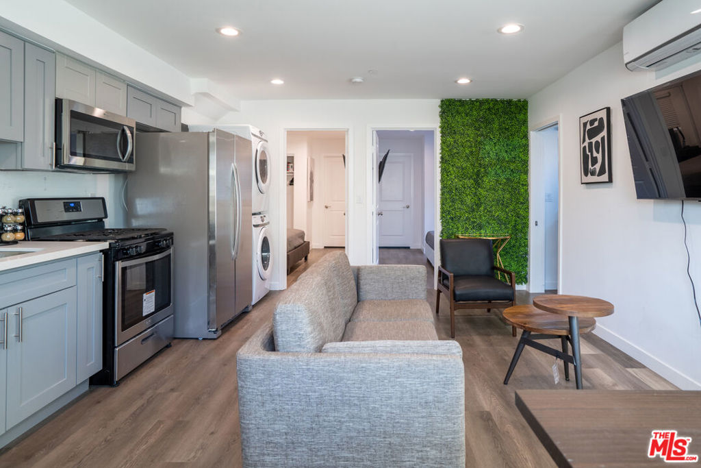 Experience modern living in this brand-new 3-bedroom, 3.5-bath townhome located near Normandie Ave and Washington Blvd, just minutes from Downtown LA, Koreatown, and USC. This spacious, light-filled home features a smart layout with en-suite bathrooms in every bedroom and a convenient guest powder room. Enjoy upscale finishes throughout, including a stylish kitchen with quartz countertops and stainless steel appliances, central air, in-unit washer and dryer, and two private balconies in the front and back, perfect for relaxing or enjoying fresh air. The property offers gated entry, 2 assigned parking spaces, and is pet-friendly with approval. Available for immediate move-in.