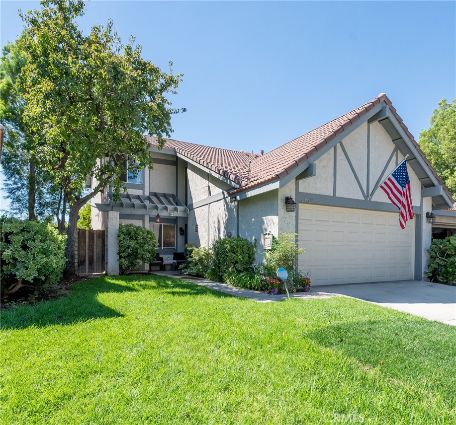 Welcome to American Beauty Gardens, where you can experience the best of both worlds in this exceptional residence that lives like a house. Step inside to a sun-filled, open-concept floor plan centered around a recently remodeled kitchen. The main floor conveniently provides a bedroom and a guest bathroom. Beyond the living and dining area, sliding glass doors open to a spacious, fully private backyard, offering an exclusive and serene retreat. The upper level hosts 3 additional bedrooms and 2 bathrooms, including a primary en suite. This home is complete with a private attached 2 car garage where laundry hookups are located. Community provides basketball courts, playground, tennis courts and a full sized pool.