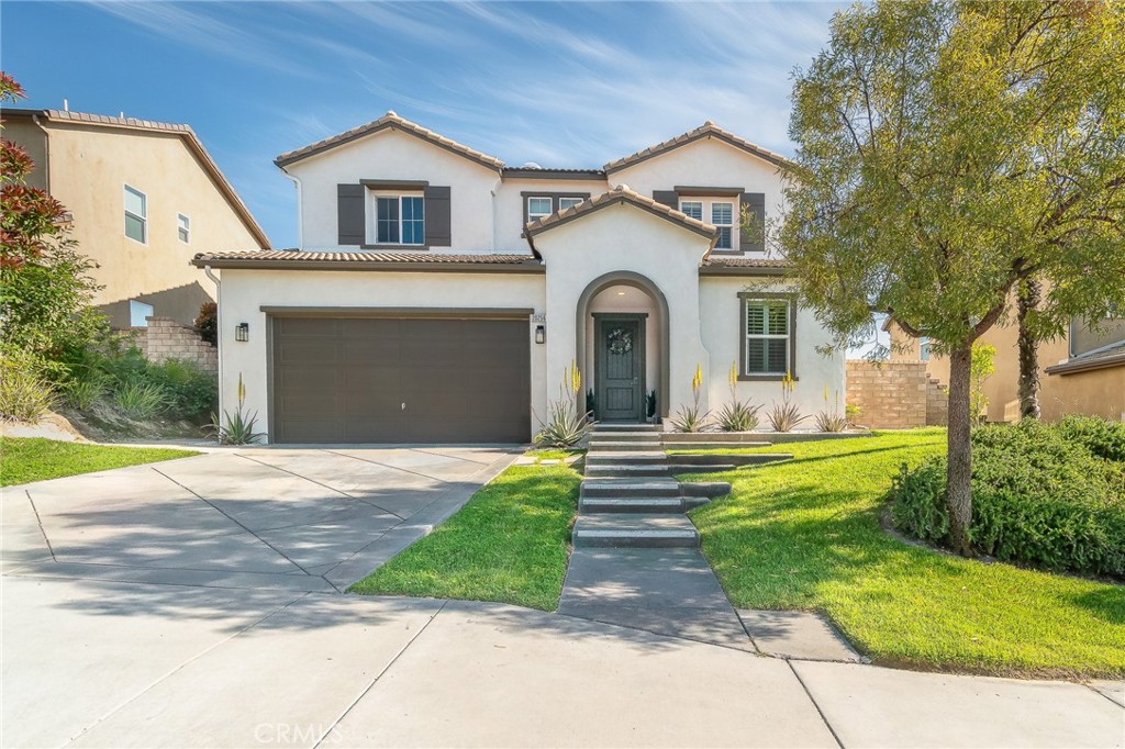 Welcome to 20256 Dorothy Street, a resort-style view home in the heart of Saugus, Santa Clarita. This former model residence has been meticulously upgraded and thoughtfully designed to deliver modern comfort, timeless style, and ultimate functionality. Every corner reflects true pride of ownership, offering a lifestyle that feels like a year-round vacation.
Step inside and you’ll be greeted by an open-concept layout flooded with natural light. Expansive windows draw your eyes to the backyard paradise, where a custom pool and spa create the centerpiece of an entertainer’s dream. Cascading waterfalls, color-changing lights, and smartphone-integrated controls bring luxury resort living right to your own home. Multiple seating areas, a fire pit, and an outdoor kitchen with built-in BBQ, sink, and refrigerator make entertaining effortless. The side yard provides versatility, with space for a dog run or play area, and currently includes a removable playground. From this private perch, you’ll even enjoy breathtaking fireworks and sweeping valley views.
Inside, the first floor features a desirable guest suite with walk-in closet and full bathroom, perfect for extended stays or multi-generational living. The chef’s kitchen offers granite counters, stainless steel appliances, double ovens, a large island, and abundant cabinetry, plus a walk-in pantry for storage. The dining and living spaces connect seamlessly for gatherings, while the oversized laundry room and partially converted garage—currently a bonus music studio or home office—add flexibility to the floor plan.
Upstairs, the primary suite is a retreat of its own, complete with a private seating area, custom walk-in closet, and spa-like bathroom featuring dual vanities, a soaking tub, and walk-in shower. Three additional bedrooms and a full bath complete the level, including one enclosed loft now serving as a fifth bedroom. Skylights and upgrades throughout add warmth and charm.
Additional highlights include 9-foot ceilings, dual-zone AC, paid-off solar, plantation shutters, EV charger, built-in security system with cameras, and a finished attic with pull-down ladder. Set on a rare 9,684 sq ft lot with no front or rear neighbors, the home enjoys privacy, natural light from sunrise to sunset, and easy access to the growing Skyline Ranch Plaza with dining, shopping, and more.
Turnkey and move-in ready, this property offers more than just a home—it’s a lifestyle.