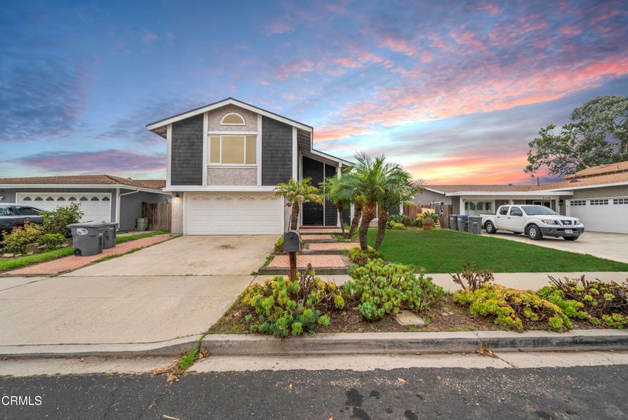 Welcome to this beautifully refreshed five-bedroom, three-bathroom home in the desirable Via Marina neighborhood. With fresh paint throughout and new carpeting, this 2,155-square-foot residence is move-in ready and waiting for its next chapter.The thoughtfully designed open floor plan creates a seamless flow perfect for modern living and entertaining. Cathedral ceilings in the living room add volume and light, while the cozy fireplace creates an inviting focal point. The recently upgraded kitchen features matching appliances, ample counter space, and a convenient pantry.The home's flexible layout offers something special for everyone. The upstairs primary suite provides a private retreat, while a main-floor bedroom and full bathroom deliver convenient single-level living options for guests or family members.Step outside to discover the true gem of this property--a large backyard patio that extends your living space outdoors. Whether you're hosting summer barbecues, enjoying morning coffee, or creating your own outdoor oasis, this versatile space adapts to your lifestyle.Located on a quiet residential street, you're just moments from Oxnard's beautiful beaches and within easy walking distance of the shops and restaurants at Seabridge. This home perfectly balances coastal convenience with comfortable neighborhood living. Experience the best of Southern California living in a home that's ready to welcome you today.