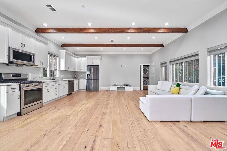 Built in 2020, this stylish attached ADU with private entry features 2 bedrooms and 2 bathrooms in one of the area's most desirable neighborhoods. The open floor plan is enhanced by soaring 11-foot beamed ceilings, abundant natural light, and modern finishes throughout.The chef's kitchen comes equipped with premium appliances, including a Samsung refrigerator, LG dishwasher, newer cooktop, and microwave. Additional highlights include an in-unit washer & dryer, central heat & A/C, wood flooring, recessed LED lighting, and dual-pane windows with custom blinds.The primary suite offers a walk-in closet, while both bathrooms feature full tubs and luxury fixtures, including 8" rainfall showers. Extras include gated 2-car side-by-side parking & Storage space plus plenty of street parking. Electric charging available. With easy access to Beverly Hills, The Grove, Farmers Market, dining, shopping, and major freeways, this home combines comfort, style, and convenience. Good credit & Income Must!!! Move-In Ready on or after 11/08/25! Currently tenants occupied!
